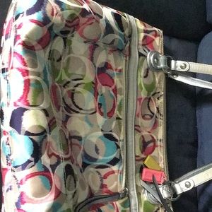 Coach multi colored shoulder bag, 17”x13”. Two zippered pockets, inside and out.